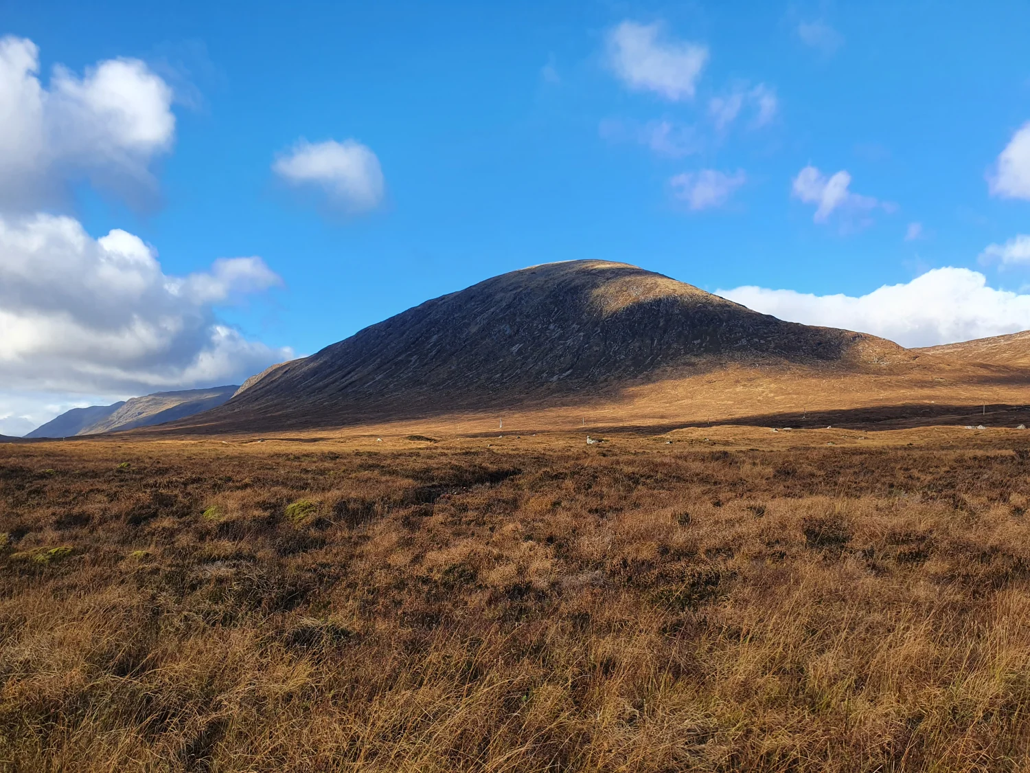 Beinn a' Chrulaiste's rounded summit rising above heather and moor grass beside the old military road across Rannoch Moor